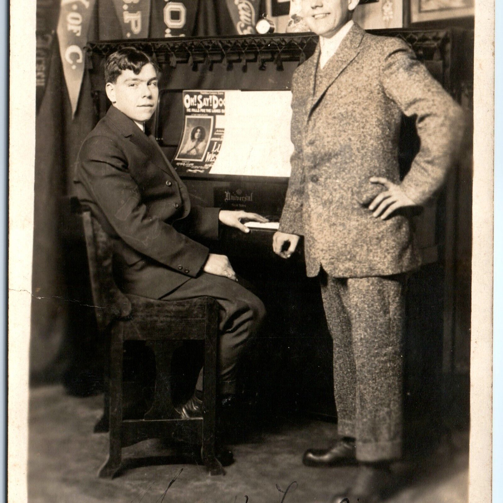 c1910s 2 Dapper Young Men & Universal Piano RPPC Dubuque, IA Clarence Brown A156