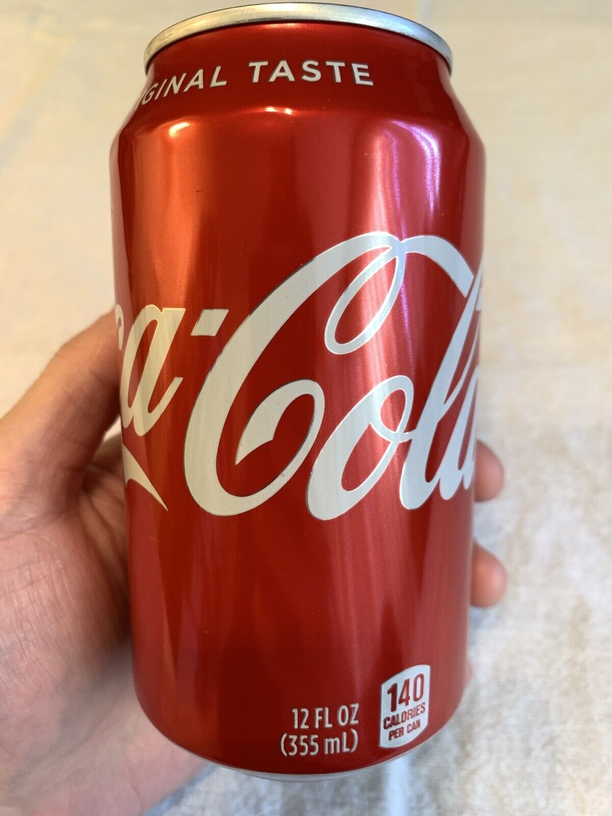 Unopened Empty Regular Coke Can