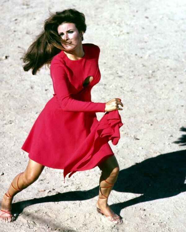 Raquel Welch running in classic red dress from Fathom 24x36 Poster