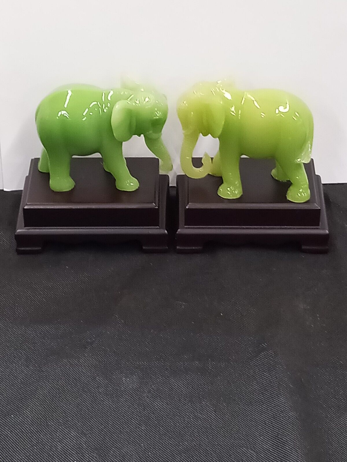 A PAIR of Green Resin Faux Jade Elephant Figurines 