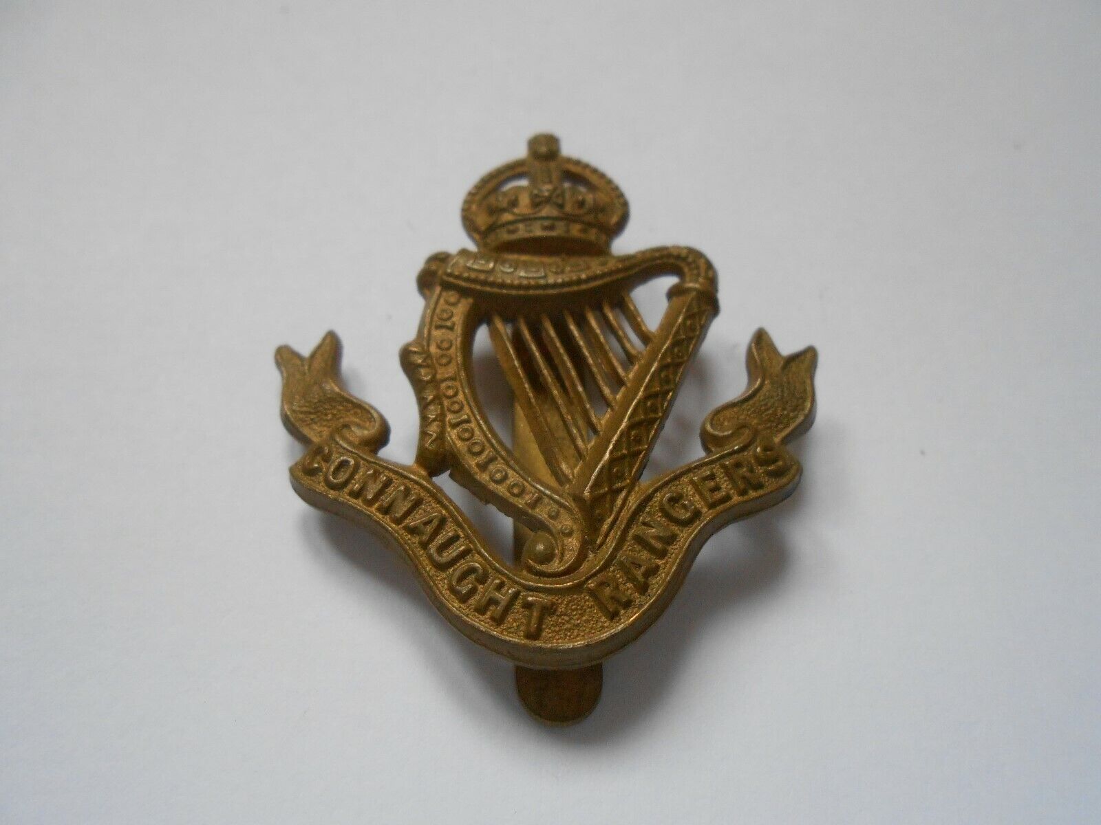 Connaught Rangers    cap badge with  slider  to reverse 