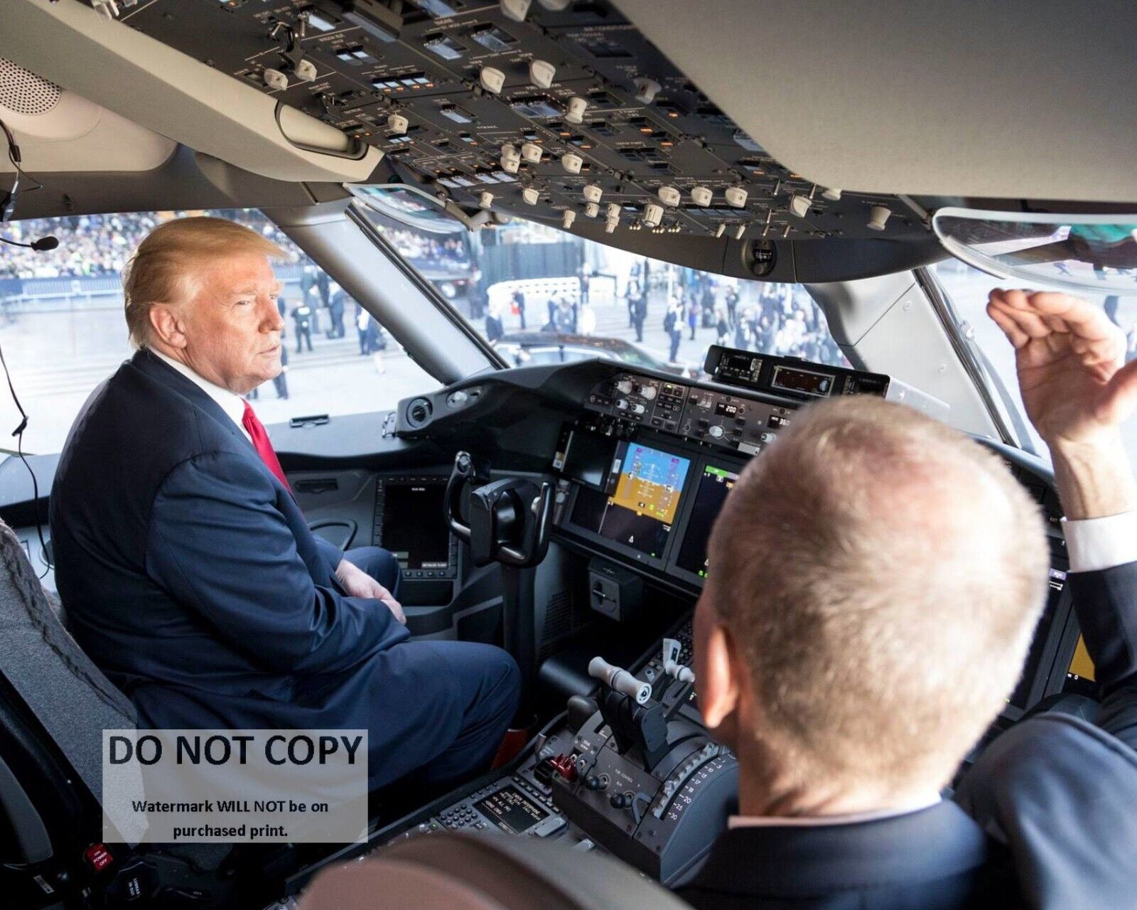 PRESIDENT DONALD TRUMP SITS IN THE COCKPIT OF A BOEING 787 - 8X10 PHOTO (AB-352)