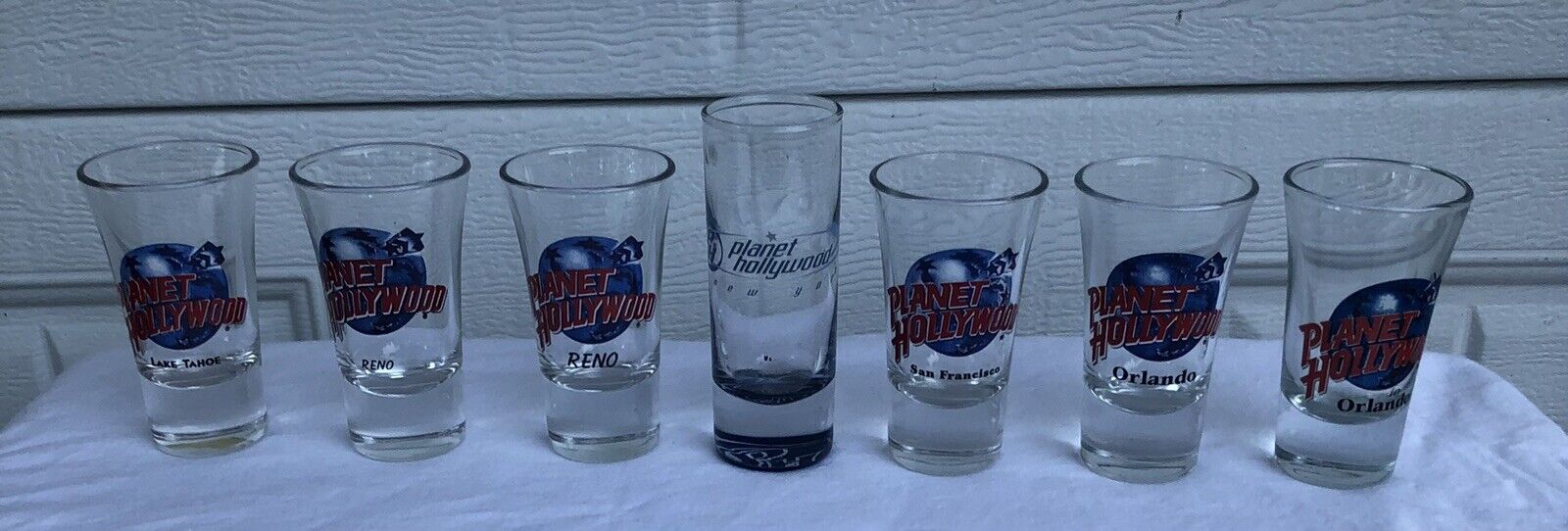 Lot of 7 Planet Hollywood Souvenir Shot Glasses 3.5 inch Flared Shooter Glass