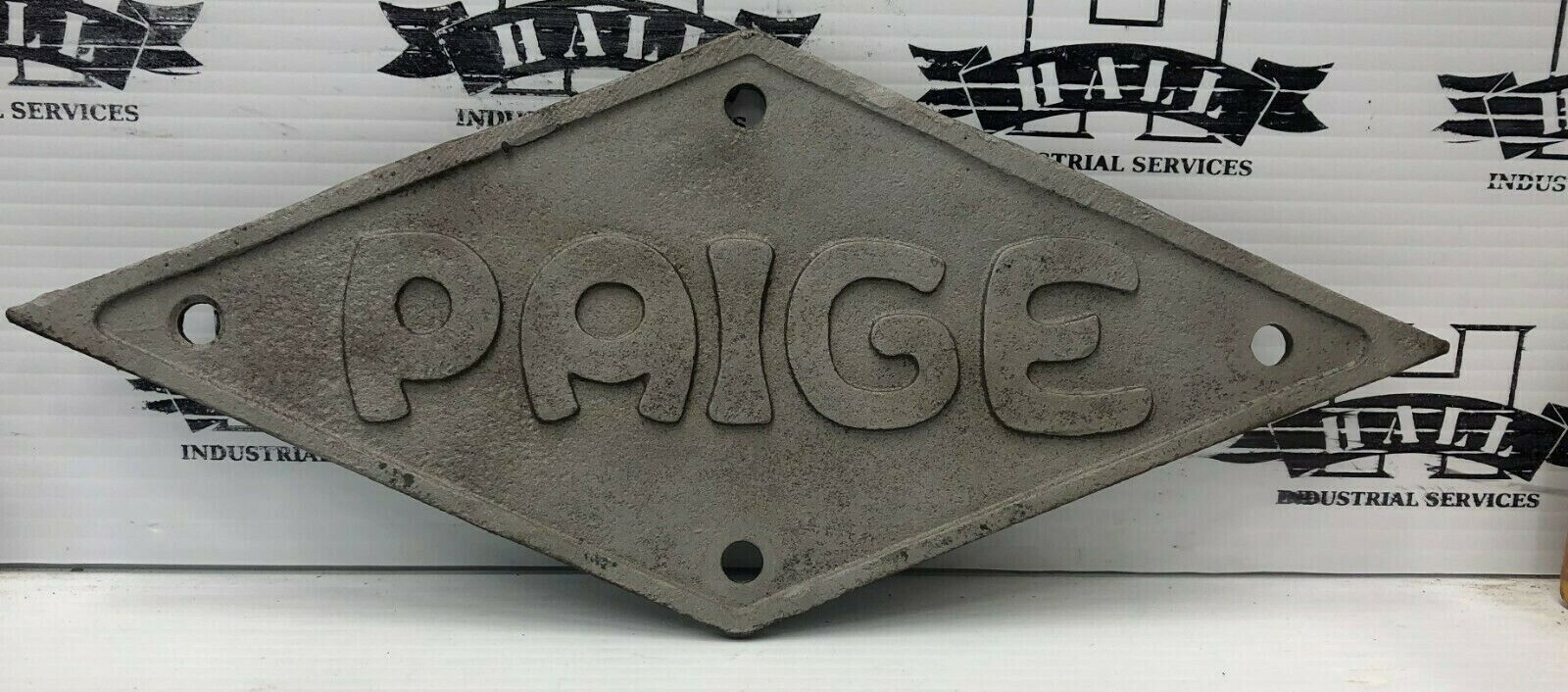 LATE TEENS OR 1920'S PAIGE CAST IRON BADGE