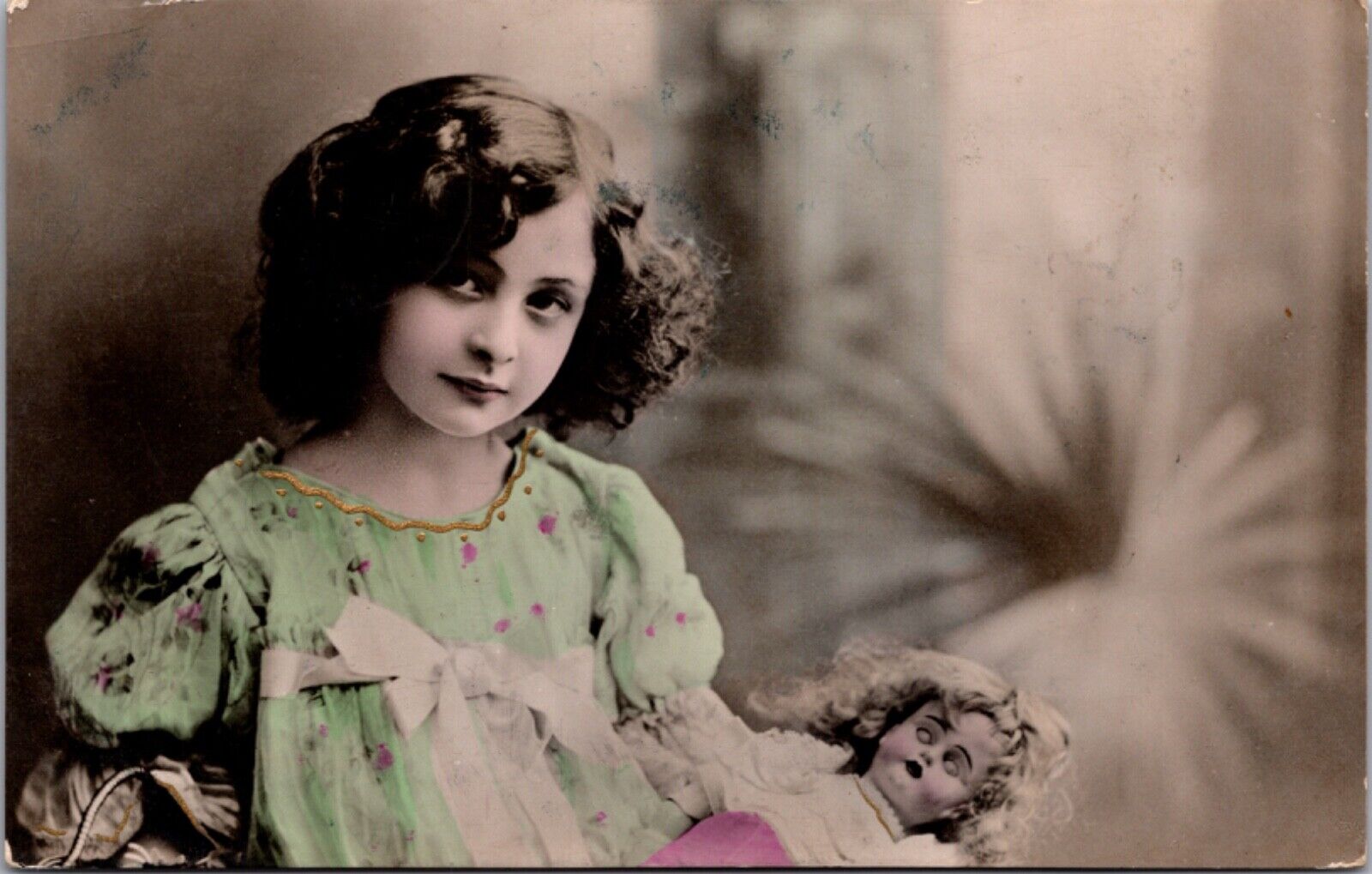 Hand Colored Real Photo Postcard Portrait of a Little Girl Holding a Doll
