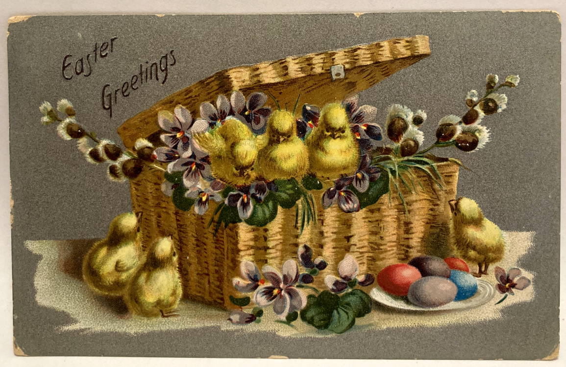 1916 Easter Greetings, Chicks in Basket, Colored Eggs, Purple Flowers Postcard