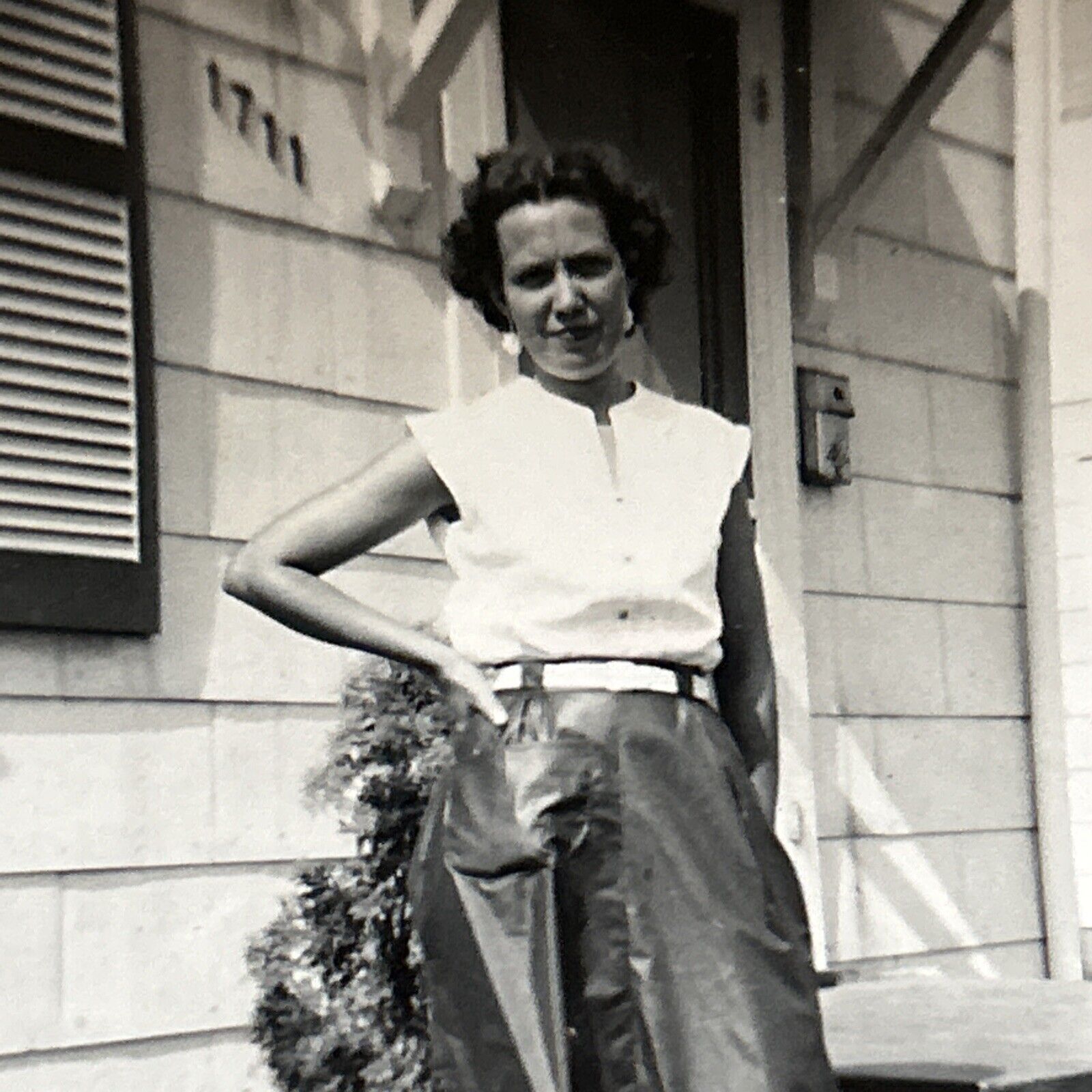 Woman Wearing Strange Plastic Pants Hand On Hip 1960s Vintage Snapshot Photo