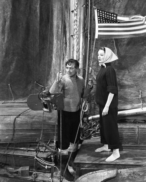 Clark Gable onboard boat with American flag with unidentified actress 8x10 photo