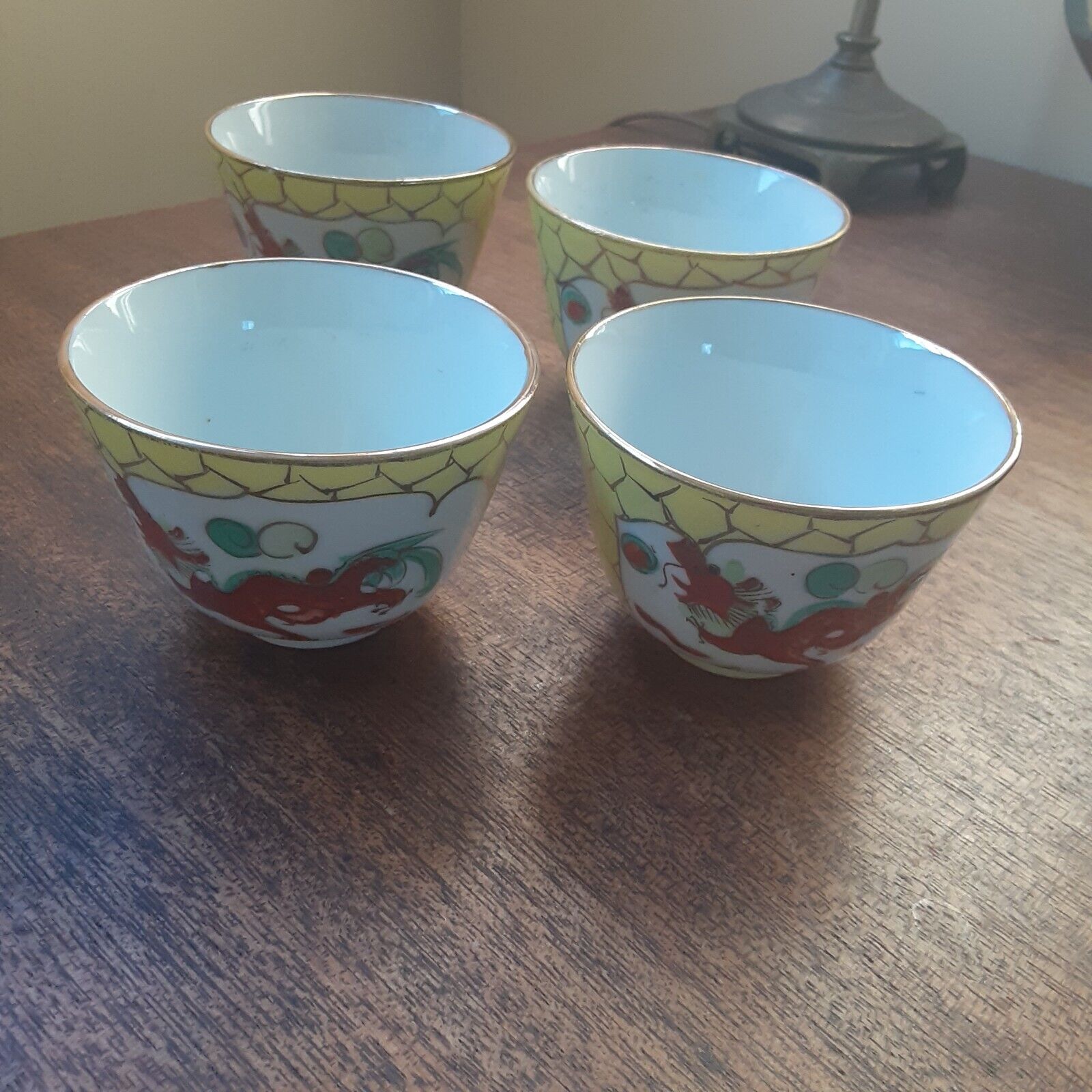 Four Vintage Japenese tea cups gold rim with dragon and phoenix bird. 3\