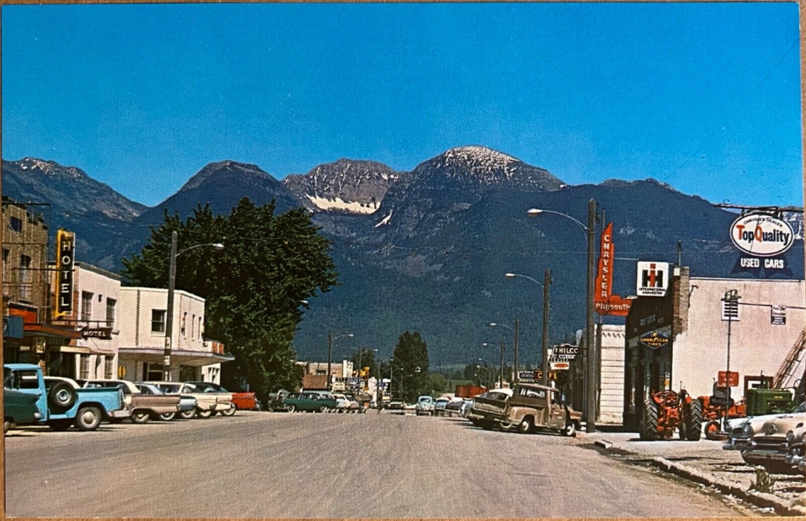 Ronan Montana Main Street Used Car Dealer Tractor Postcard c1960