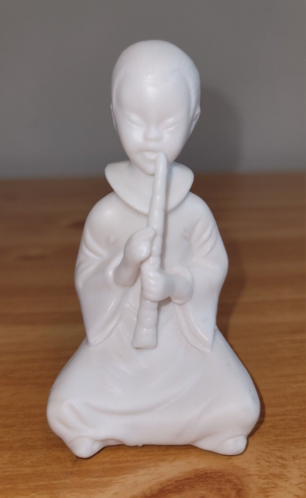 Small White Ceramic Figurine Of Japanese Boy Playing Instrument