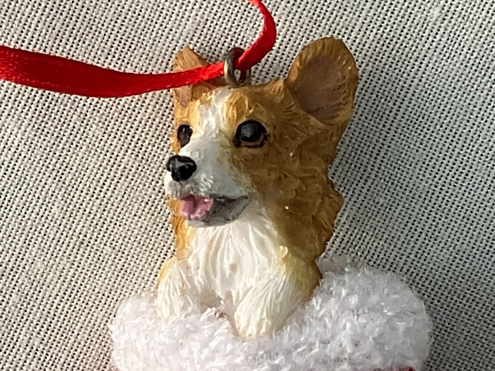 WELSH CORGI IN A RED CHRISTMAS STOCKING, REALISTIC LOOKING. HANDPAINTED.