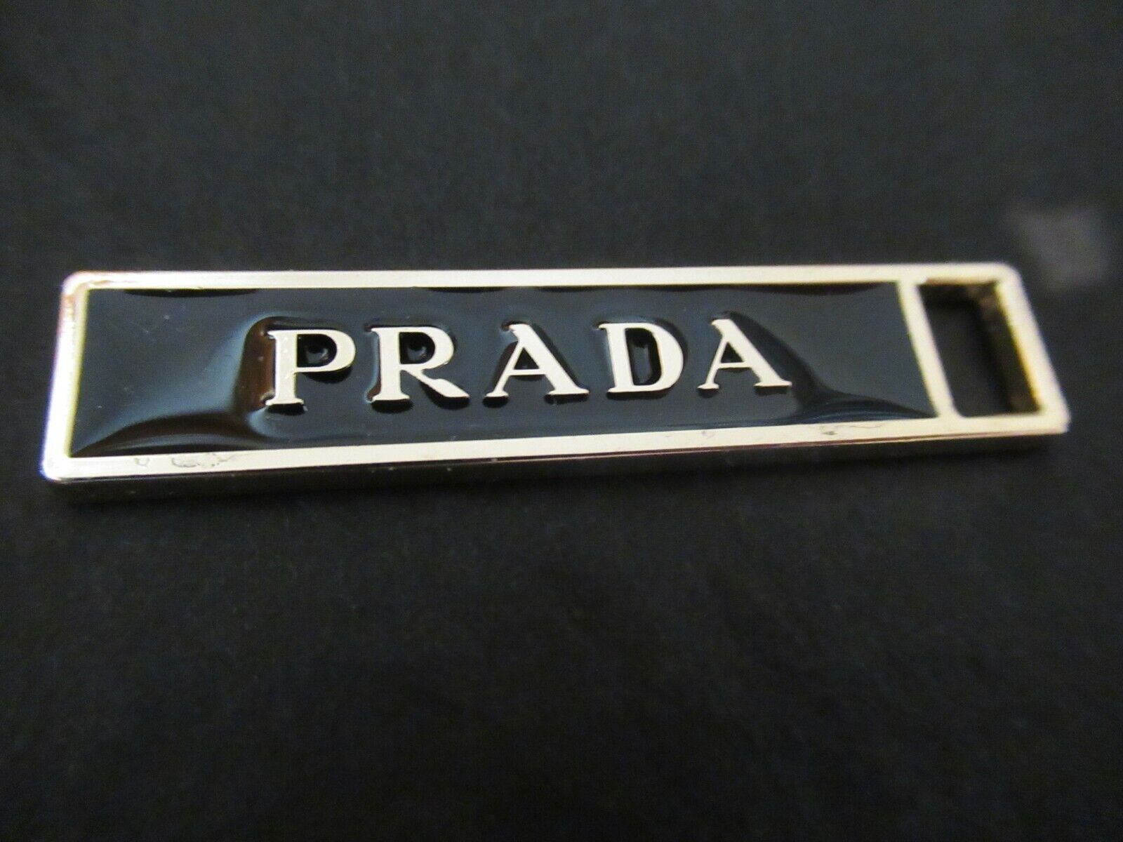 PRADA ZIP PULL   46mmx10mm gold tone BLACK ,   THIS IS FOR 1