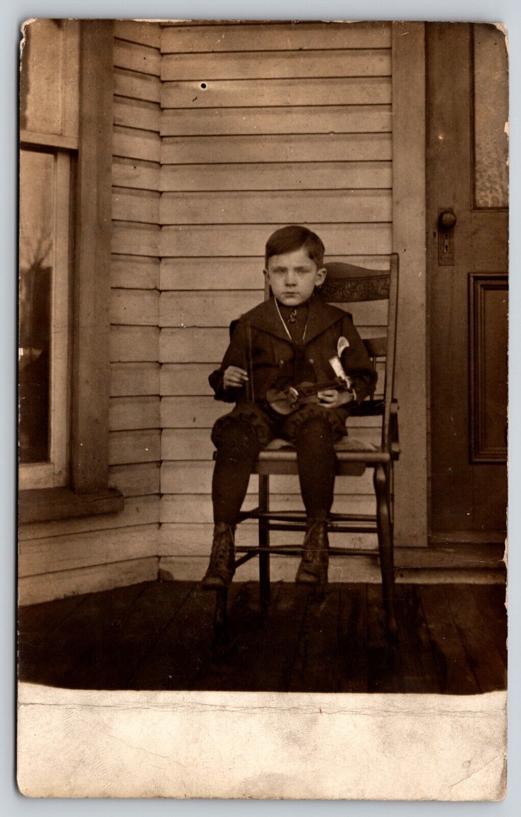 Postcard RPPC Seated Boy Holding Toy Violin Real Photo Children Music