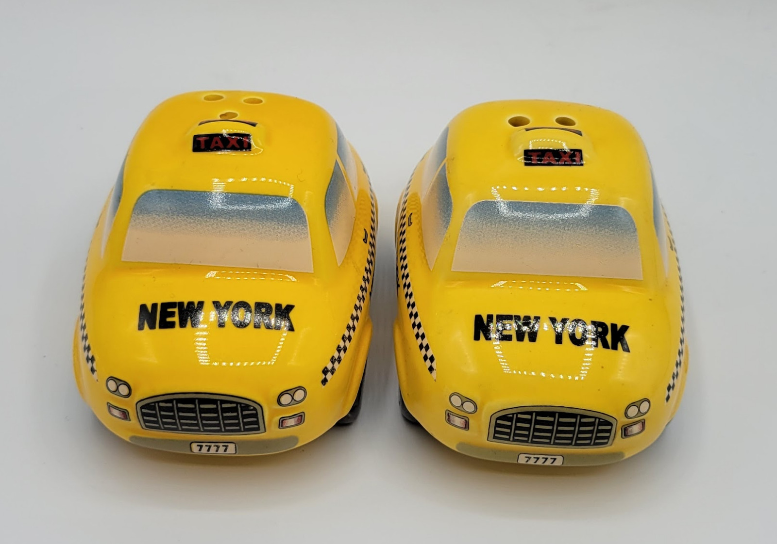 NEW YORK CITY YELLOW TAXI CAB SALT AND PEPPER SHAKERS COLLECTIBLE