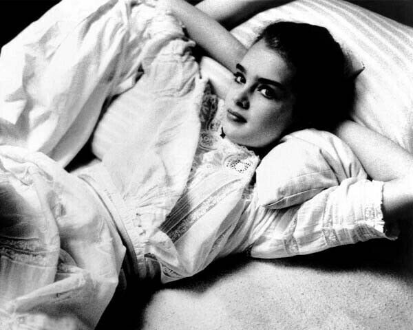 Brooke Shields relaxes back on her pillow in bed 1978 Pretty Baby 8x10 photo