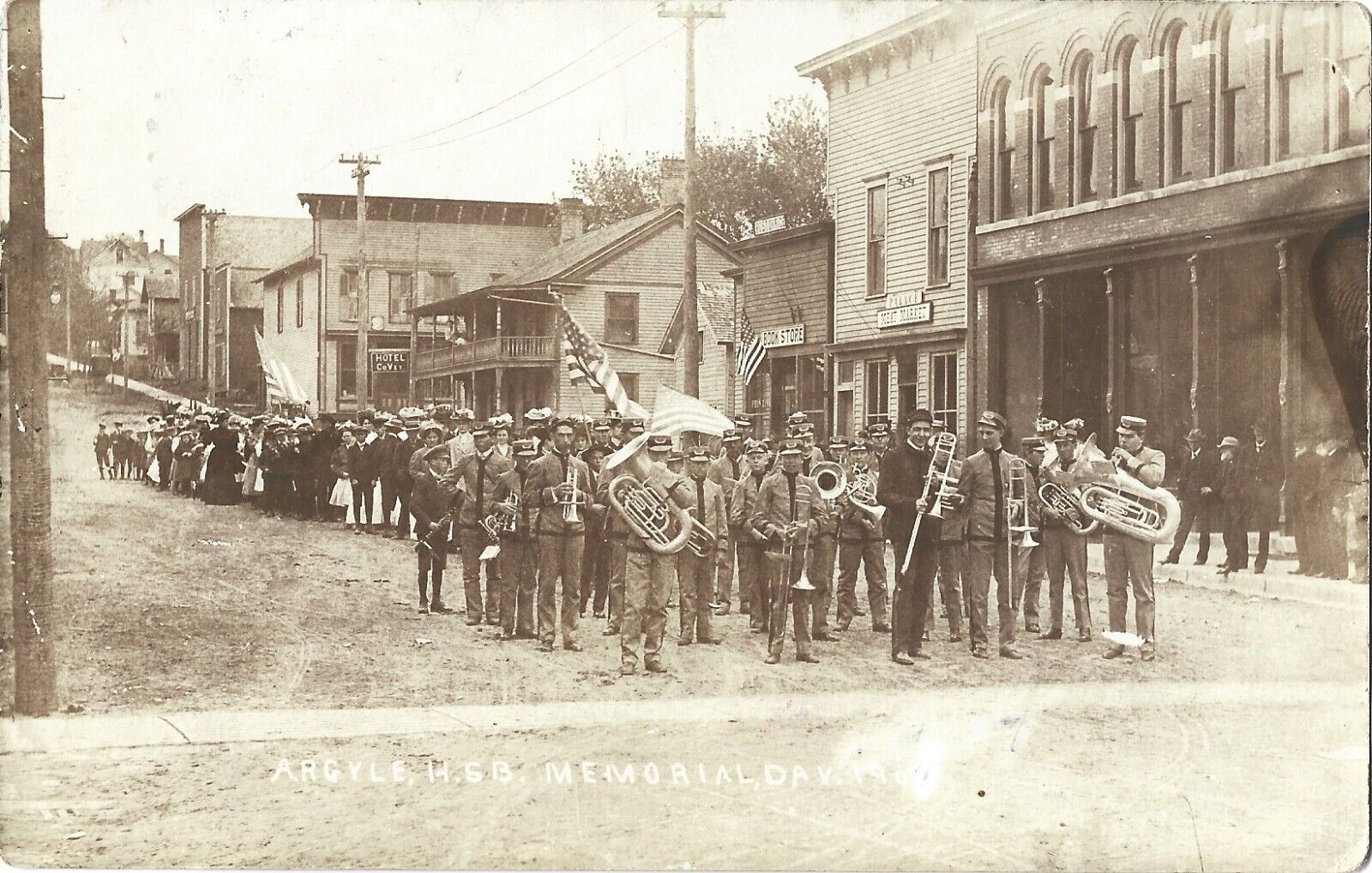 Argyle WI -- High School Band, 1907 Memorial Day Parade, store fronts; nice RPPC