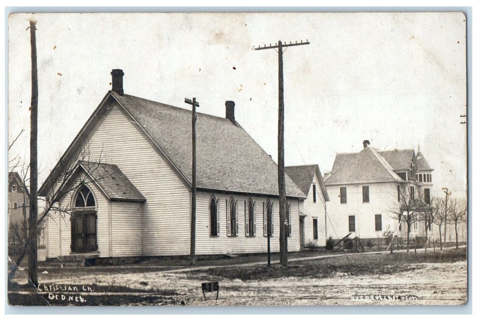 Ord Nebraska NE RPPC Photo Postcard Christian Church Dirt Road Scene Street