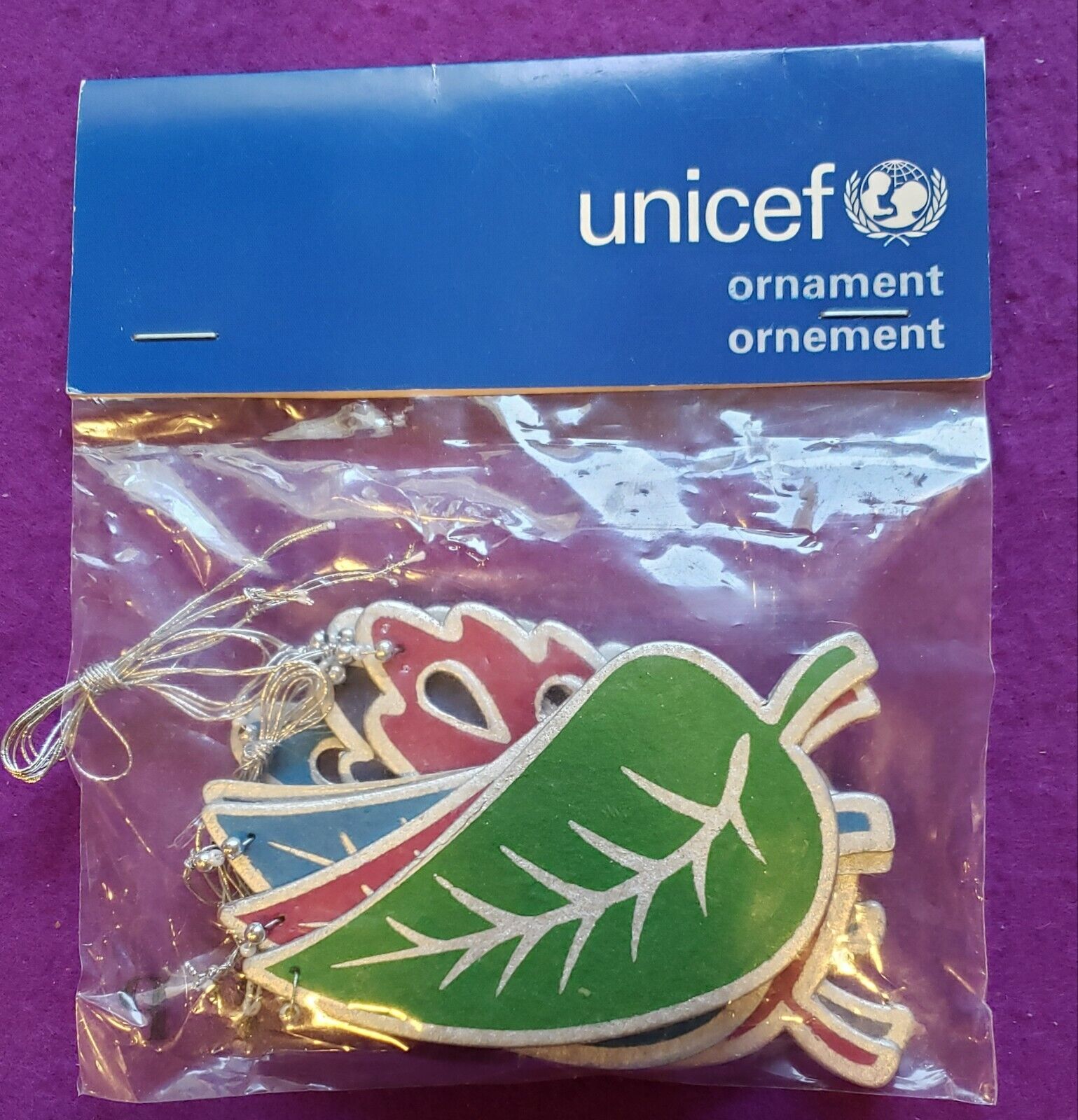 Pack of 8 Unicef Leaf Christmas Ornaments Silver trim with blues, green, red