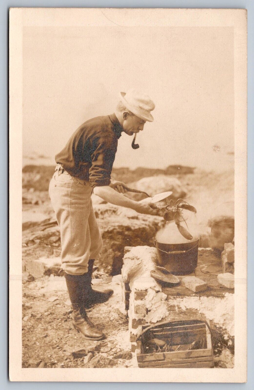 1940s RPPC MAN COOKING LOBSTER ON BEACH smoking pipe wearing hat