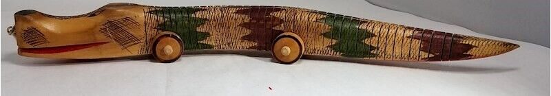 Psikhelekedana carving from Maputo Mozambique depicting a snake on wheels