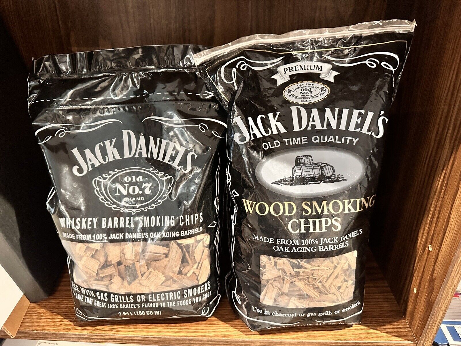 Two different bags of Jack Daniel\'s Whiskey Barrel Wood BBQ Smoking Chips