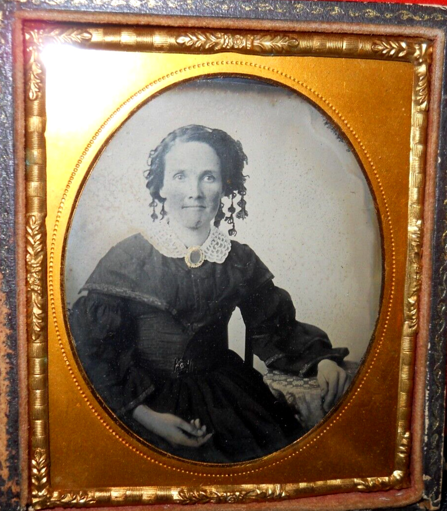 1/6th size Ambrotype of young lady with curls in half case