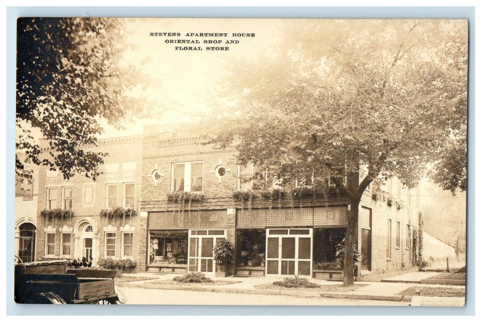 c1910 Stevens Apartment House Oriental Shop Flower Store RPPC Photo Postcard