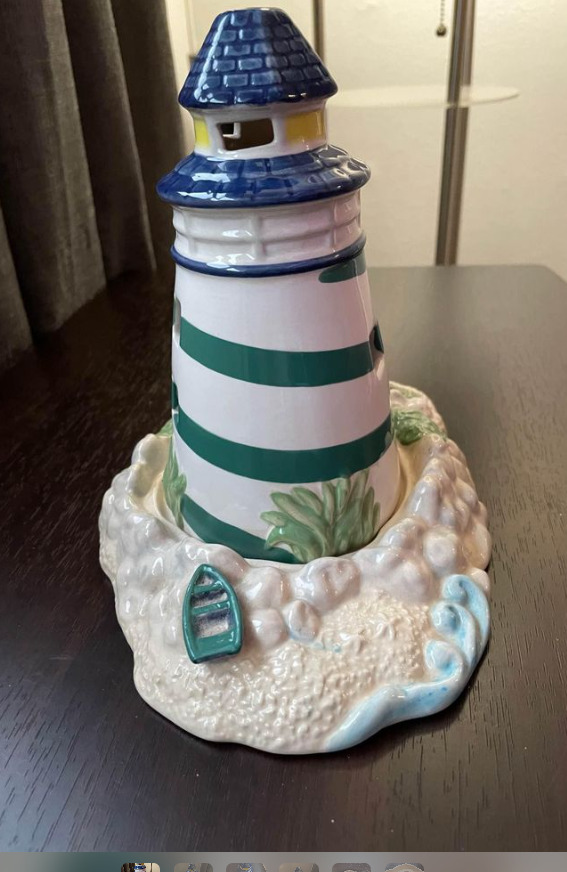 Porcelain lighthouse on platform