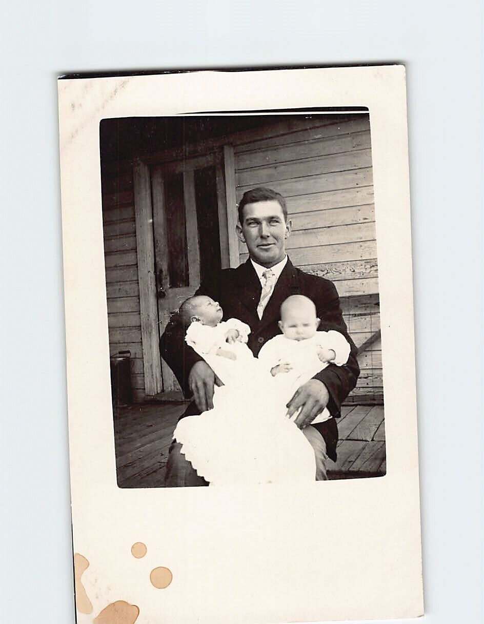 Postcard A Man by the Porch Holding Two Babies