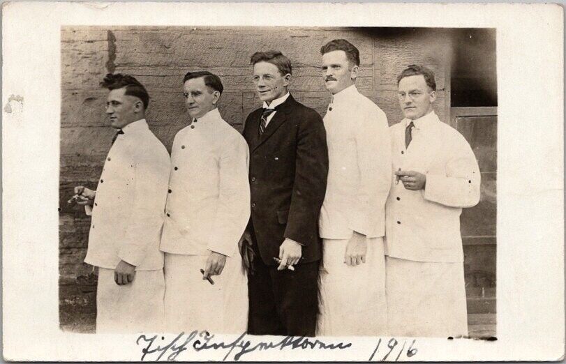 1916 CONCORDIA COLLEGE Moorhead MN RPPC Photo Postcard Men in White Coats Cigars