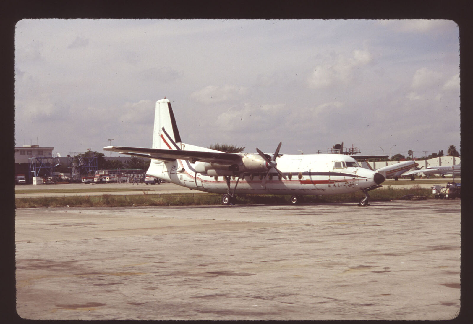 Orig 35mm airline slide Ex-Business Express F27 (derelict) [3123]