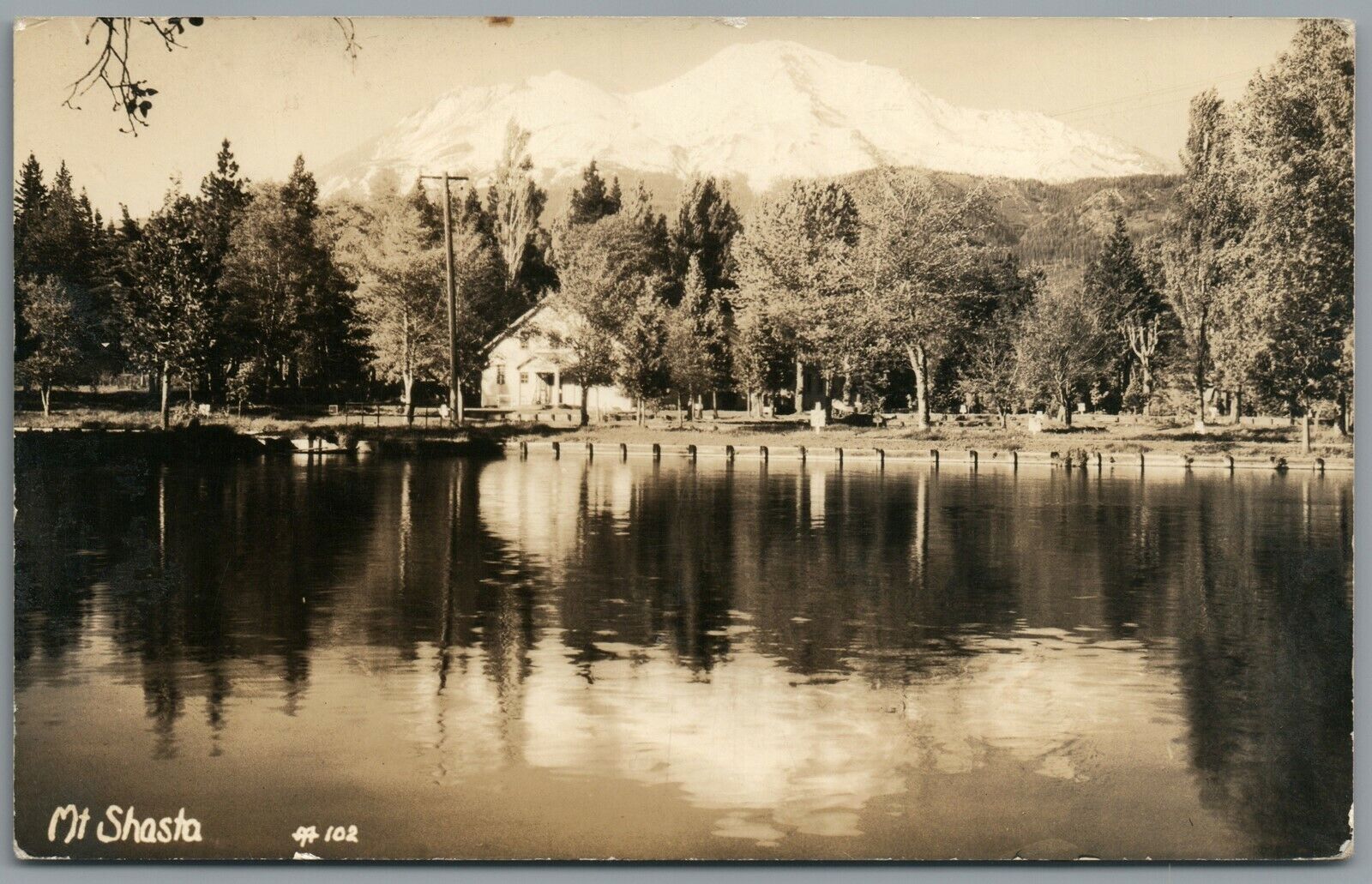 RPPC Postcard Mt Shasta CA California calm lake view with house in the tree line