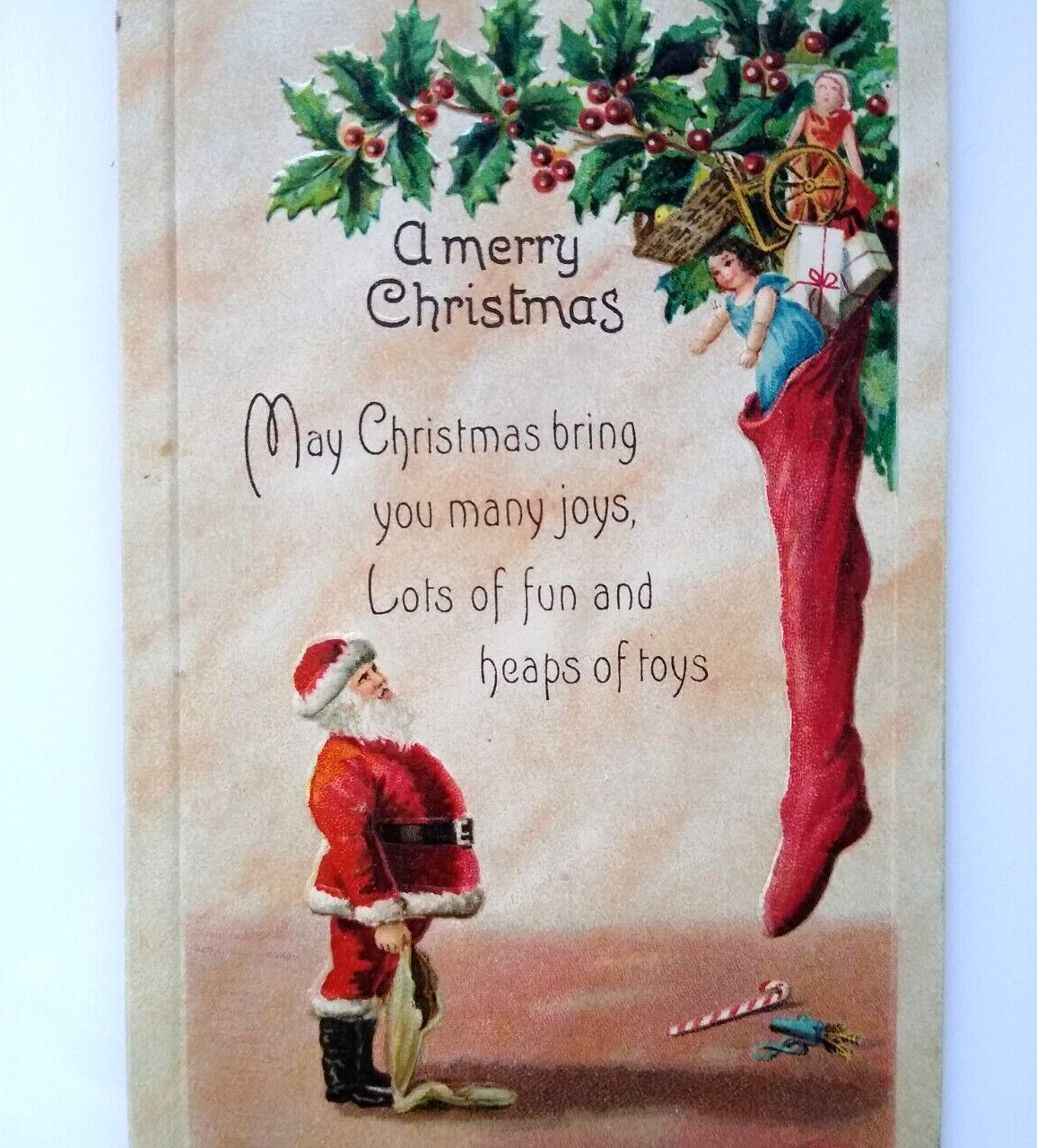 Santa Claus Father Christmas Postcard Giant Stocking Of Toys Embossed Germany