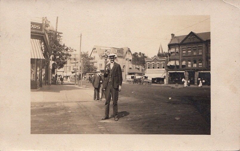 RPPC Postcard Man Standing Center of Town c. 1900s
