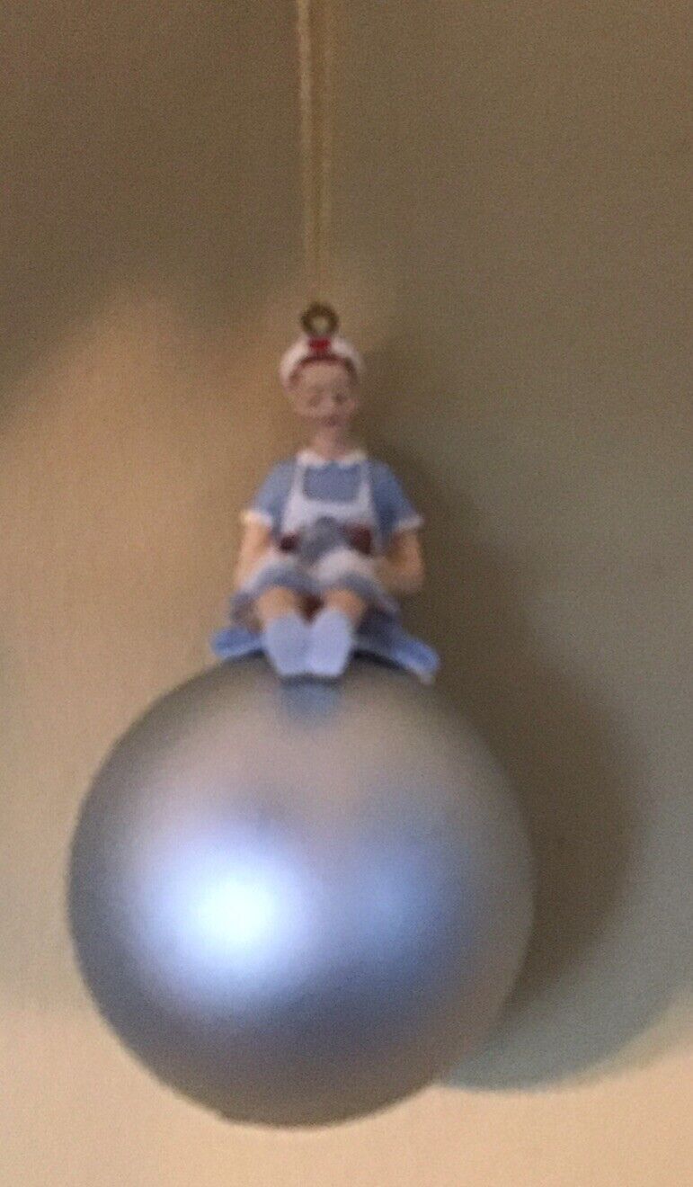 Nurse Sitting on Bulb Bauble Christmas Ornament