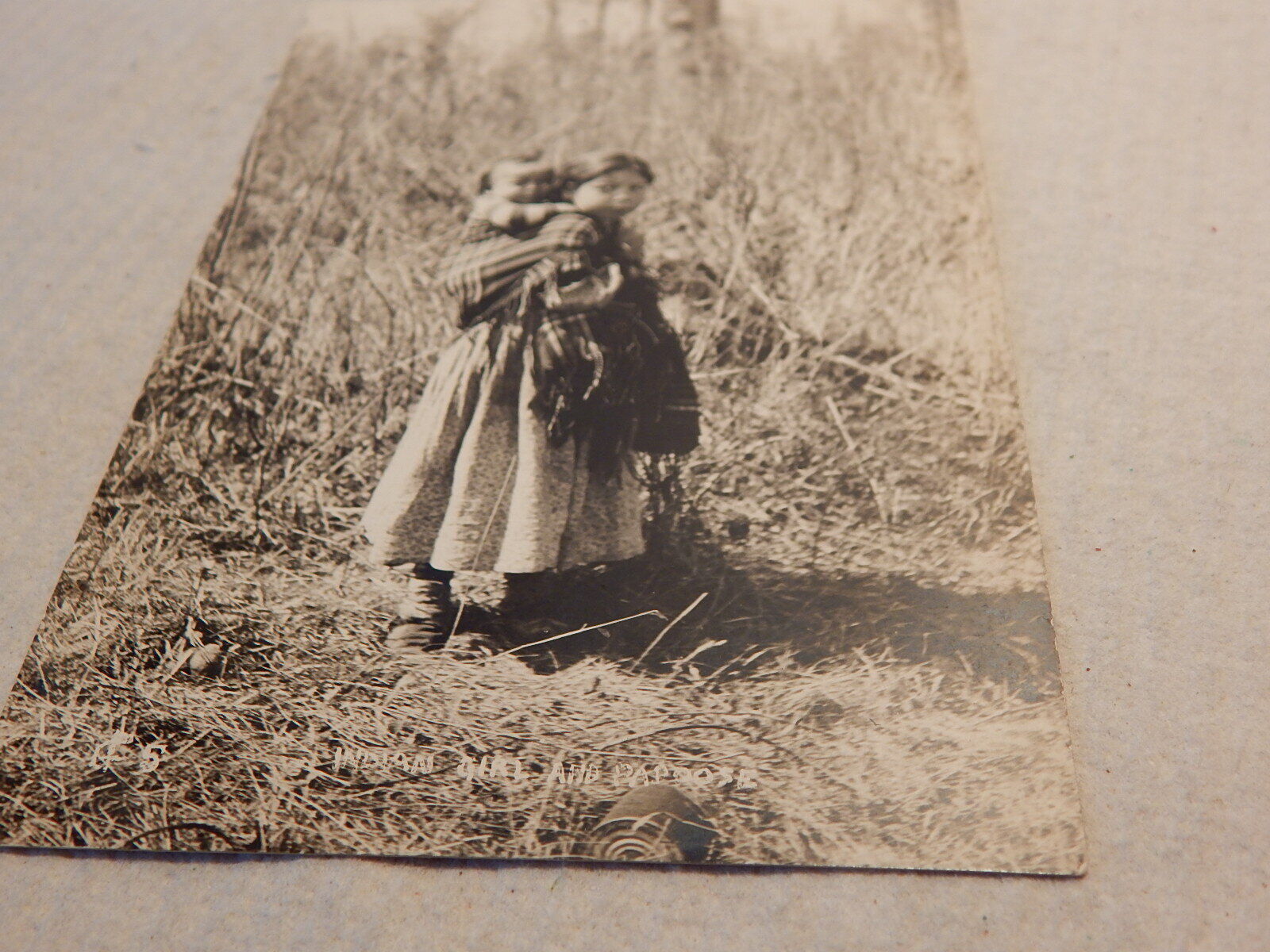 VTG 1920S 30S RPPC REAL PHOTO POSTCARD SMALL INDIAN GIRL WITH PAPOOSE NOT HAPPY