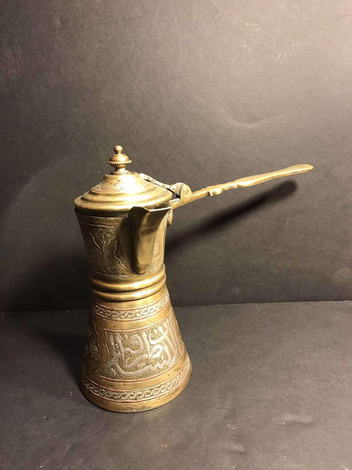 An Antique Brass Islamic Coffee Pot With Inlaid Copper And Silver C. 1900