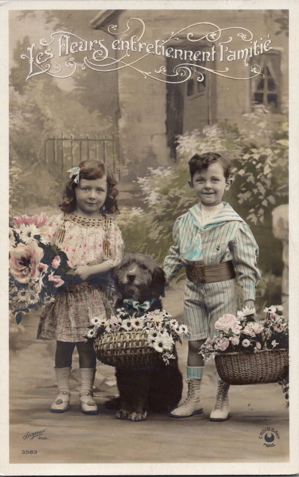 RPPC Adorable Children Boy Girl With Puppy Dog Floral Arrangement Photo Postcard