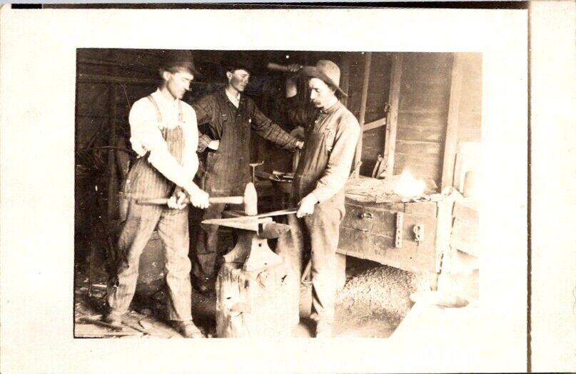 RPPC Postcard Three Men in Blacksmith Shop Work at an Anvil c.1910-1920s   12280