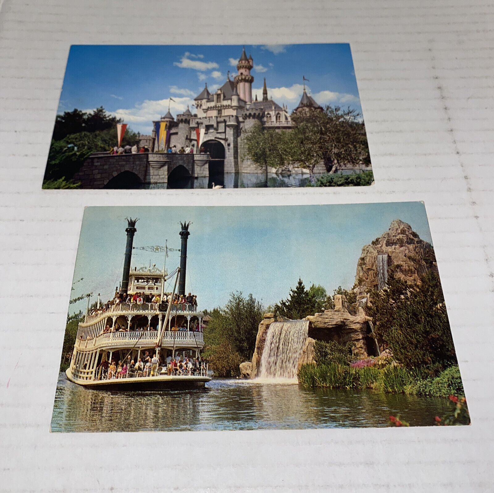 2 LOT Vintage Disneyland Postcards Sleeping Beauty Castle MTwain Frontierland