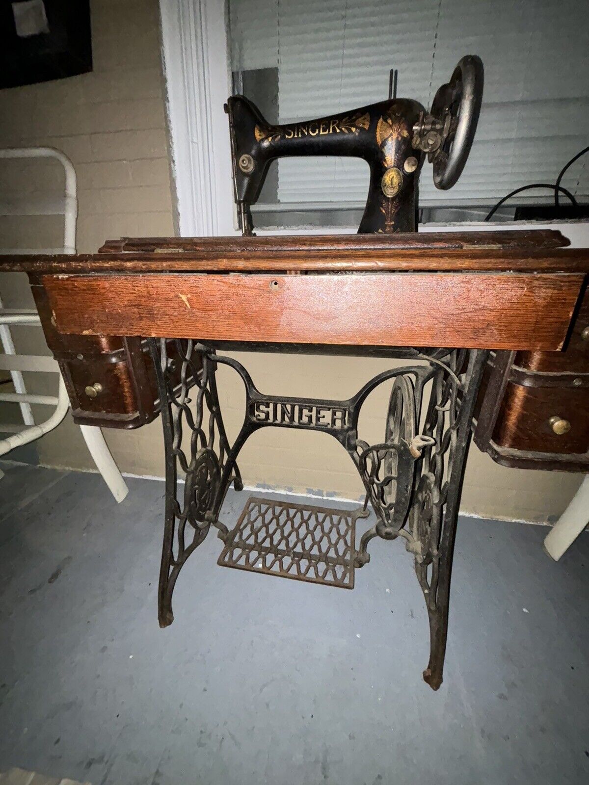 Antique Singer sewing machine and desk. G series serial number.