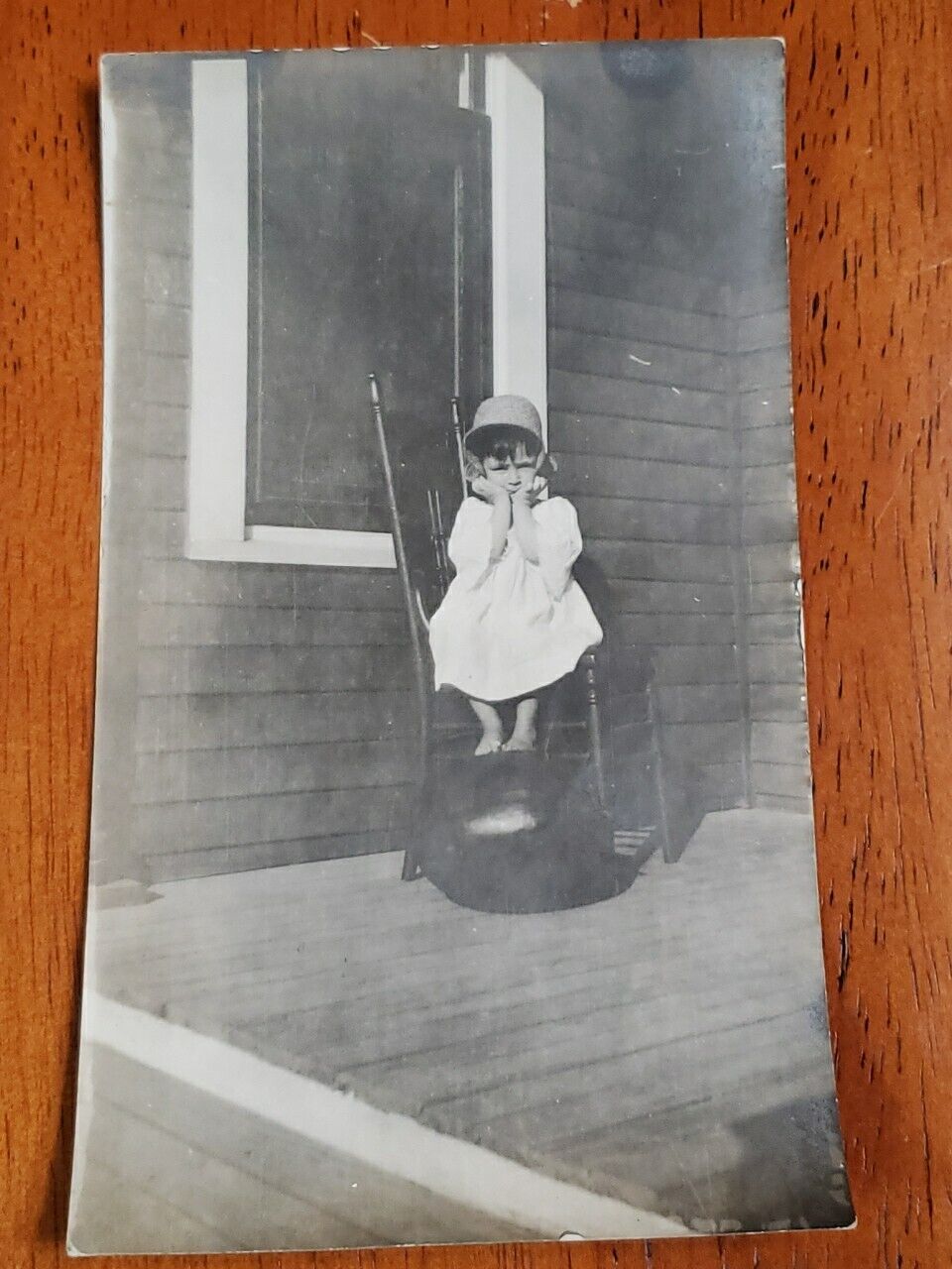 Vintage Photo Frustrated Little Girl in Time Out Bonnet Barefoot Early 1900s