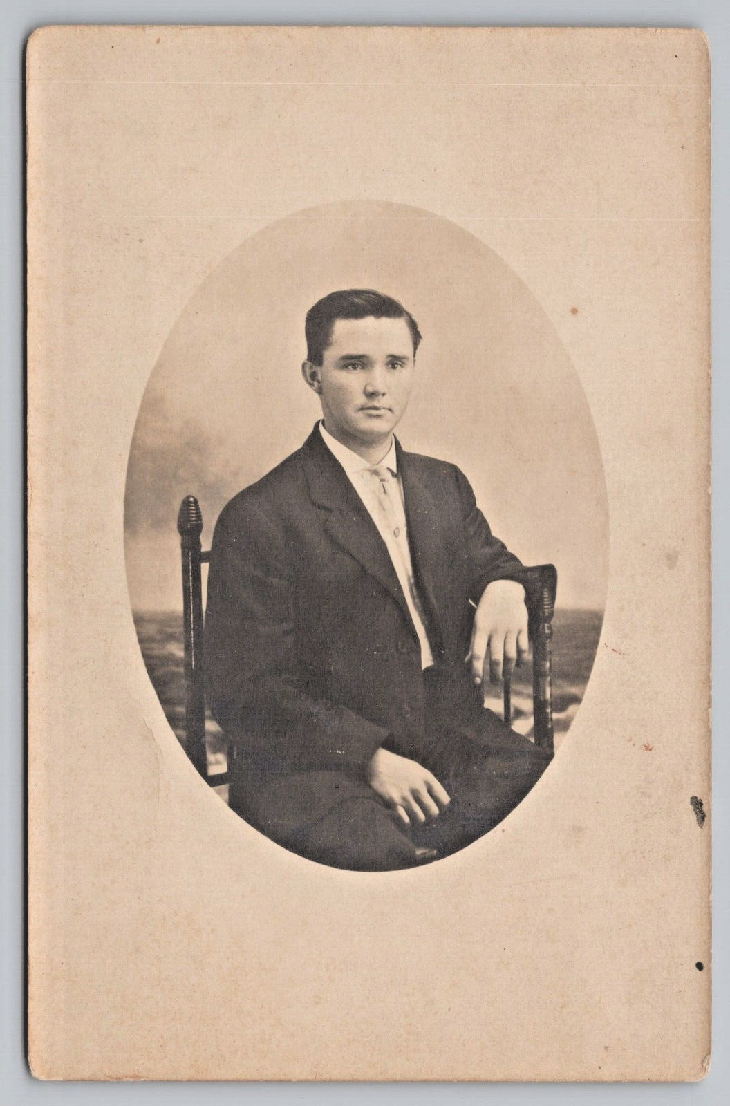 Postcard Vintage RPPC Handsome Young Man Sitting in Chair Studio Photo