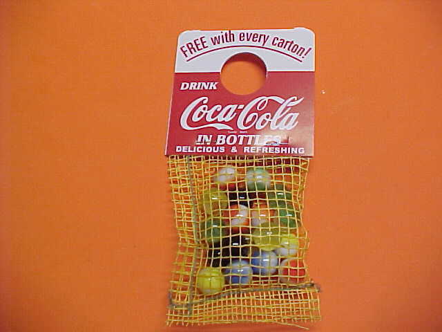 Coca Cola Marbles in yellow mesh bag 1960s.New old stock.Mint