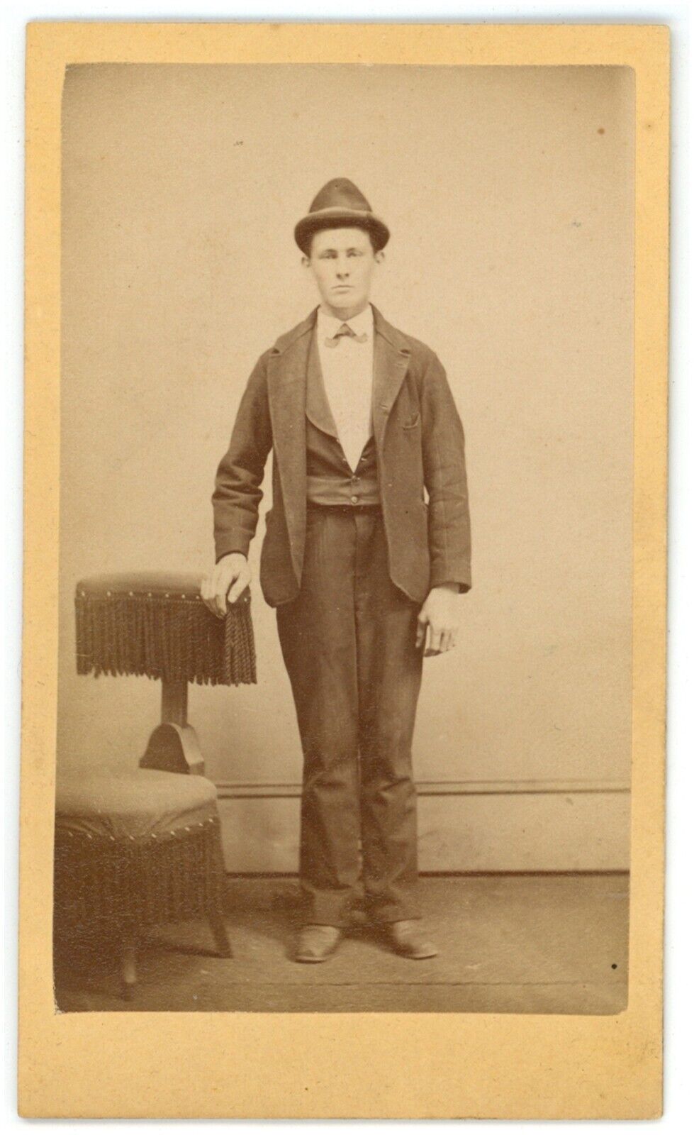 CIRCA 1880'S CDV Featuring Man Wearing Suit and Funny Looking Hat In Studio