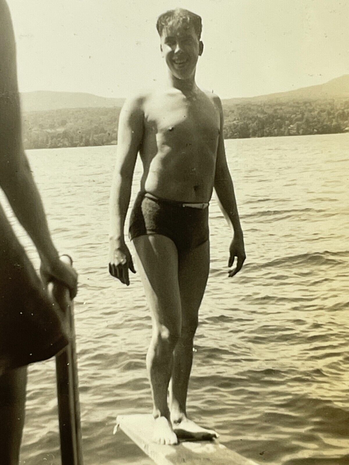 XH Photograph Handsome Man Standing On Wood Plank Bathing Suit Lake Cute