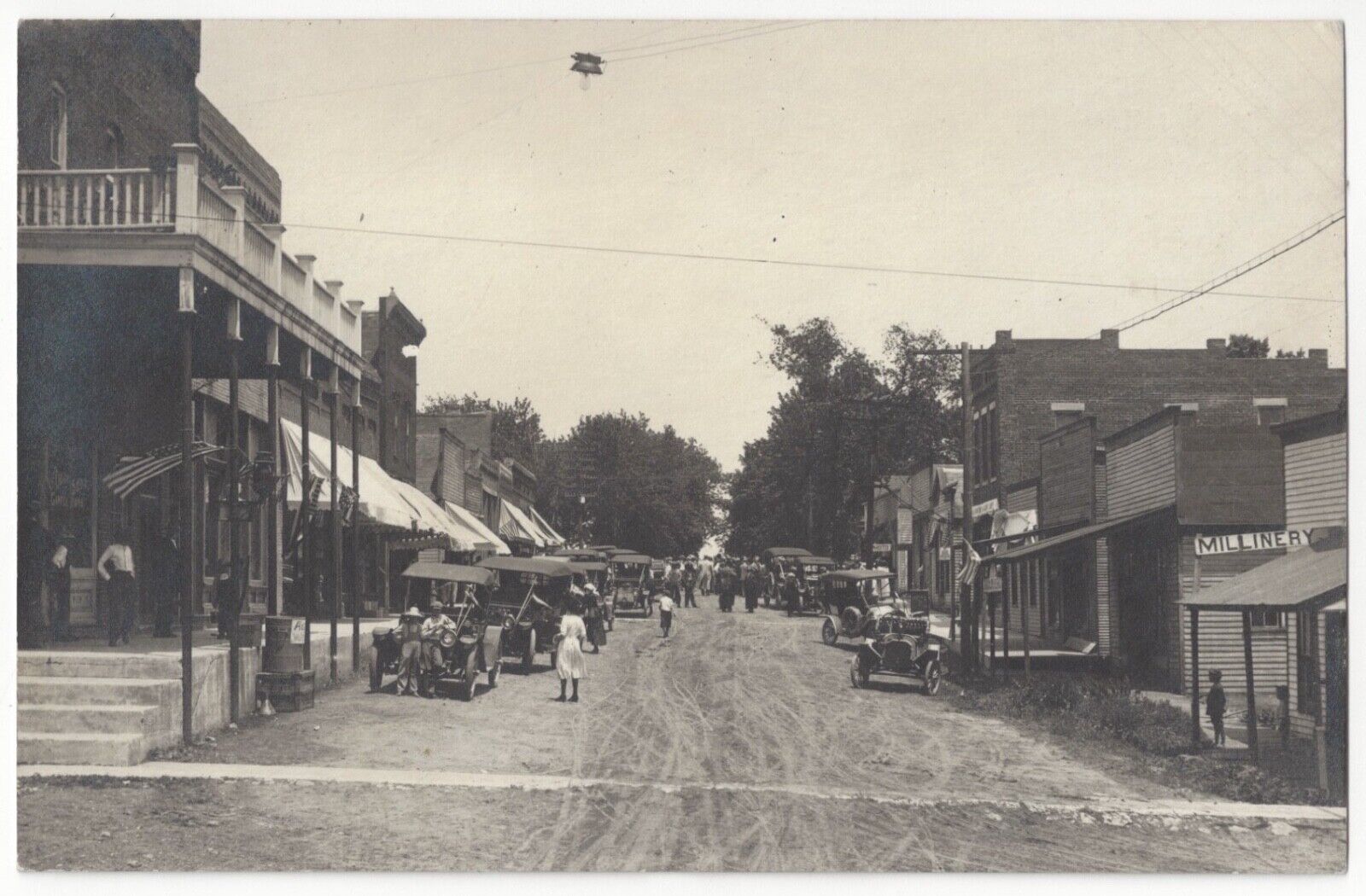 1913 Bucklin, Missouri - REAL PHOTO Main Street - Millinery & Photo Studio