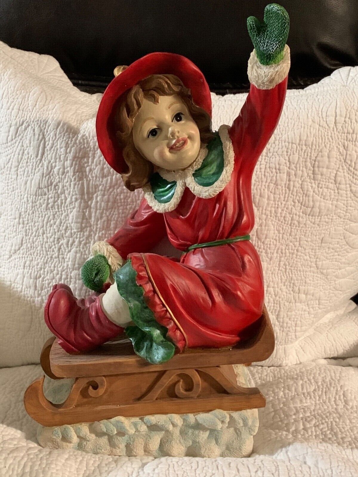 VERY CUTE FIGURINE OF A GIRL ON A SLED MADE OF PORCELAIN NWT