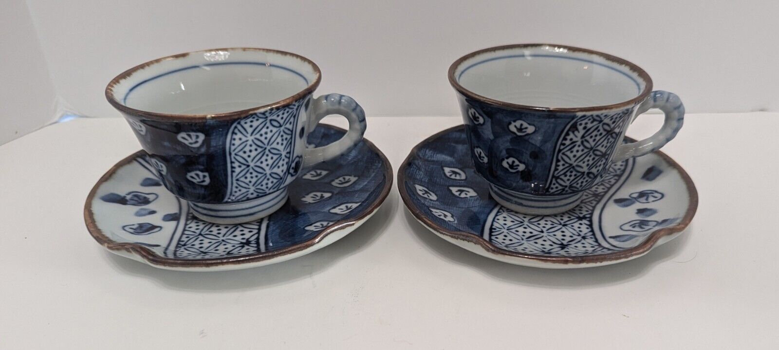 Pair of Vintage Japanese Arita Ware Blue and White Tea Cups and Saucers